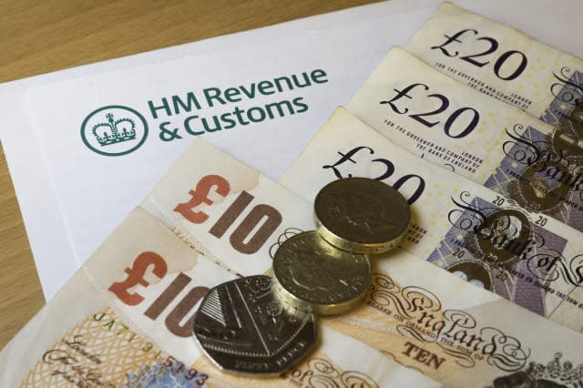 A HMRC (Her Majesty's Revenue and Customs) letter head surrounded by British bank notes and coins.