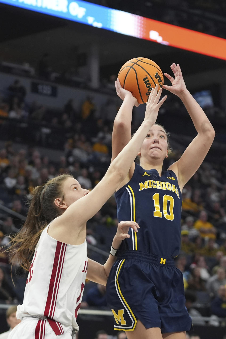 Michigan guard Jordan Hobbs (10) shoots against Indiana guard Yarden Garzon during the first half of an NCAA college basketball game in the quarterfinals of the Big Ten women's tournament Friday, March 8, 2024, in Minneapolis. (AP Photo/Abbie Parr)