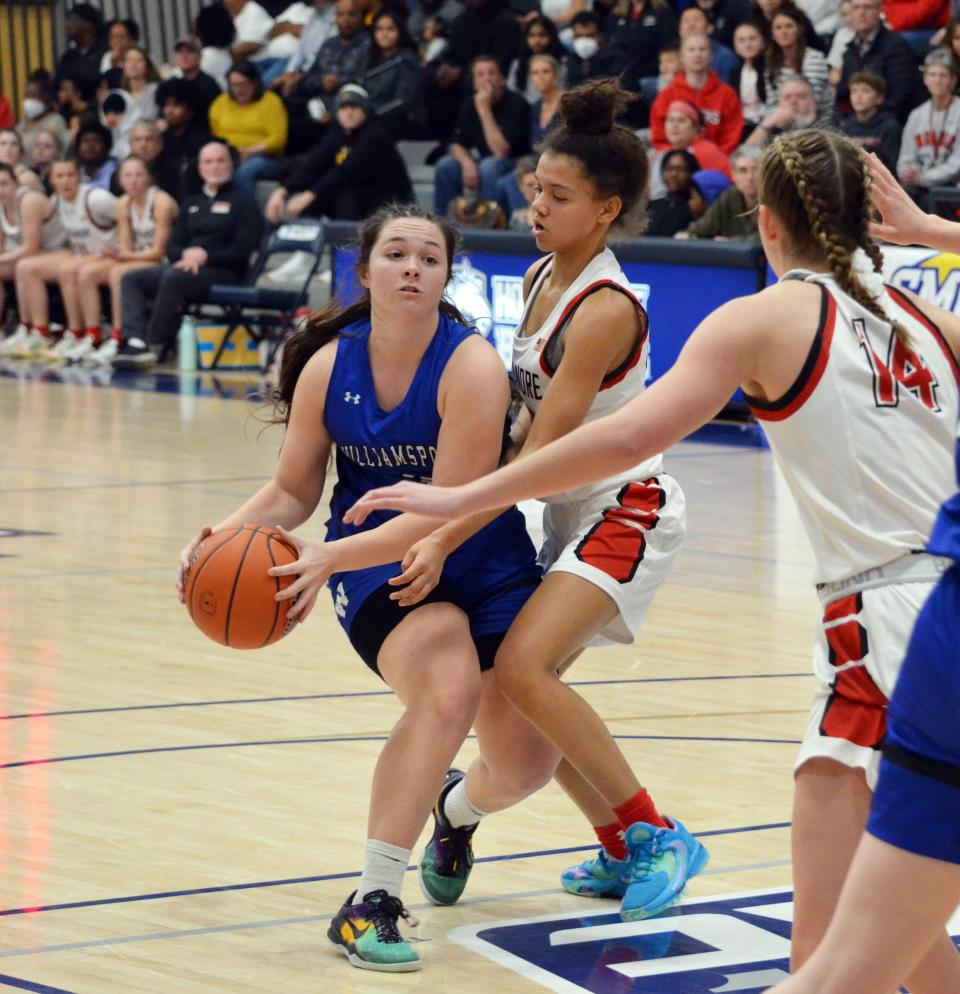 Williamsport's Paige Smith is defended by Linganore's Trinity Lindblade and Julia Mitchell (14) during the Central Maryland Conference championship game at Hood College.