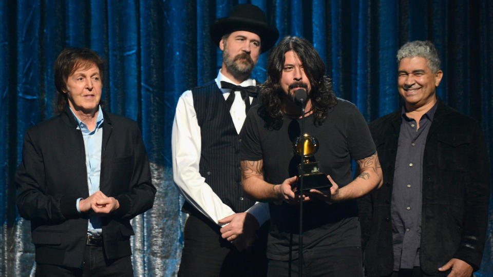 Paul McCartney, Krist Novoselic and Dave Grohl accept award onstage during the 56th GRAMMY Awards at Staples Center on January 26, 2014 in Los Angeles, California.