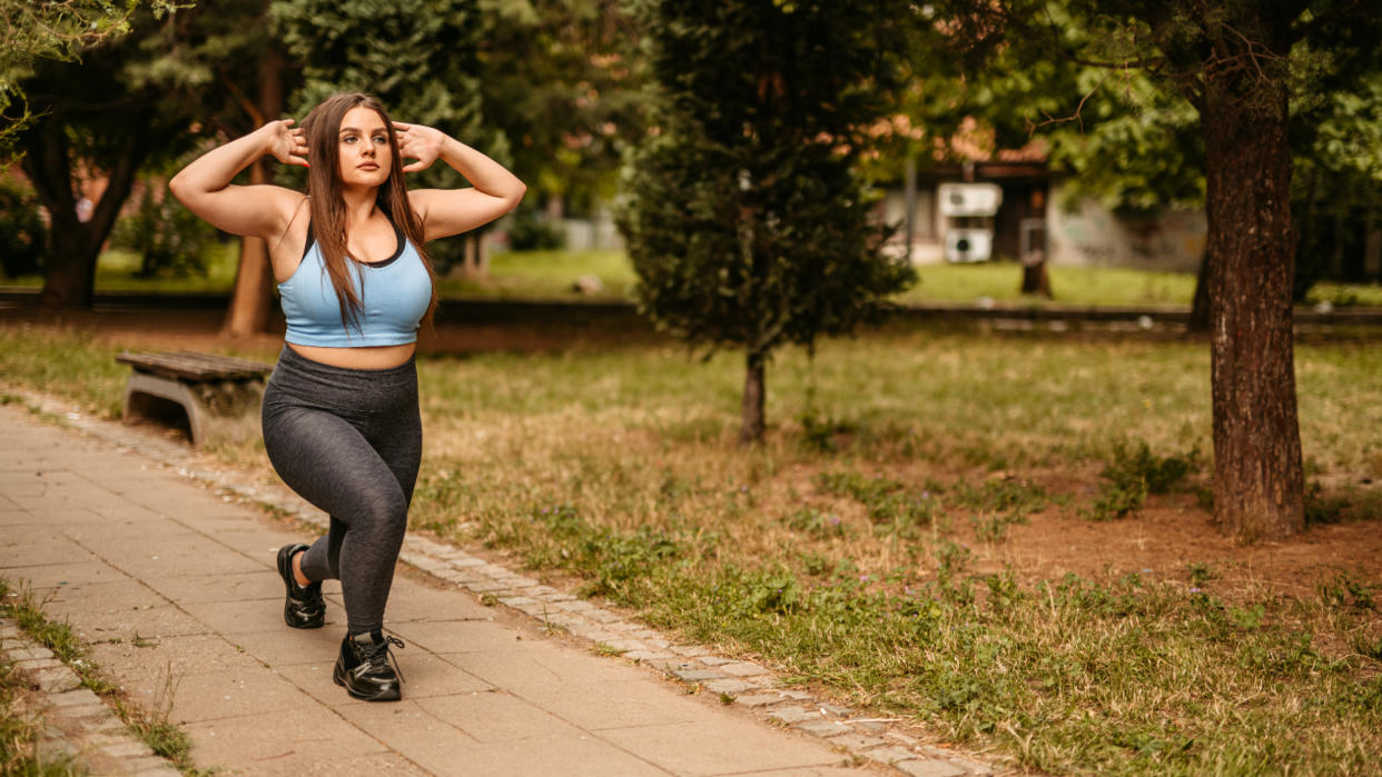  Woman performing lunges outside 