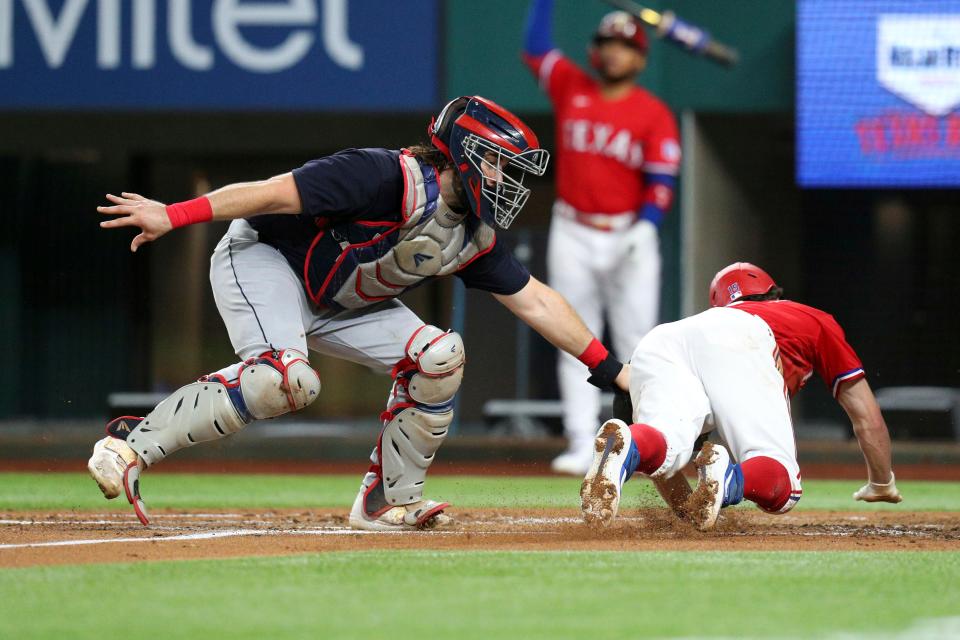 Cleveland catcher Austin Hedges (17) tags out Texas Rangers Nick Solak (15) at home in the second inning of a baseball game Friday, Oct. 1, 2021, in Fort Worth, Texas. (AP Photo/Richard W. Rodriguez)