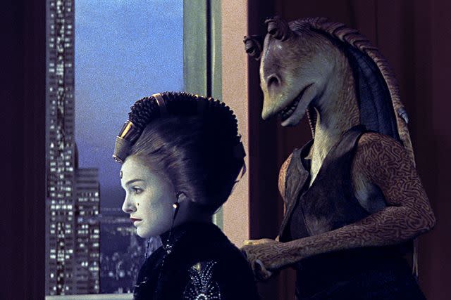 <p>Lucasfilm/Kobal/Shutterstock </p> Natalie Portman and Ahmed Best's Jar Jar Binks in 1999's 'The Phantom Menace'