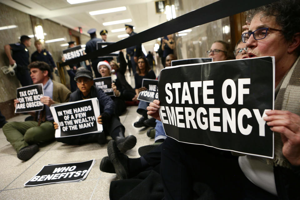 <p>Protesters block the halls outside of the Senate Budget Committee markup of the FY2018 Budget reconciliation legislation in Washington, Nov. 28, 2017. (Photo: Joshua Roberts/Reuters) </p>