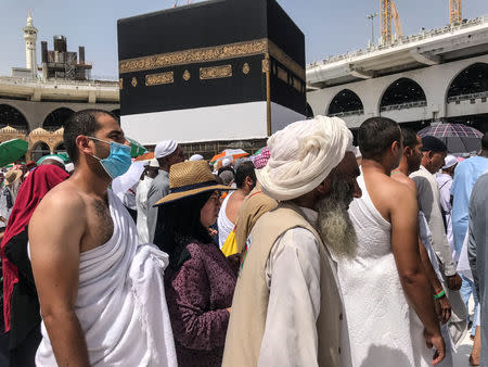 Muslim pilgrims circle the Kaaba and pray at the Grand mosque during the annual haj pilgrimage in the holy city of Mecca, Saudi Arabia August 14, 2018. Picture taken August 14, 2018.REUTERS/Zohra Bensemra