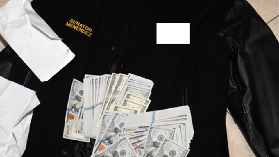 Prosecutors included this photo of a jacket bearing Menendez's name underneath $100 bills. - US District Court Southern District of New York
