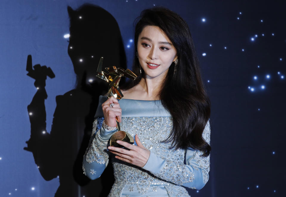 Chinese actress Fan Bingbing poses after winning the Best Actress Award of the Asian Film Awards in Hong Kong in 2017. Source: AP