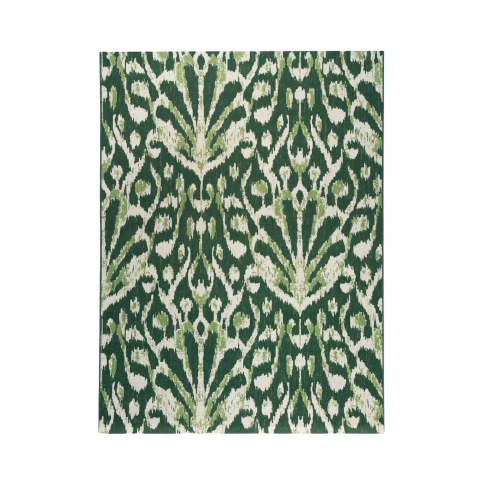 Green peacock-inspired outdoor rug