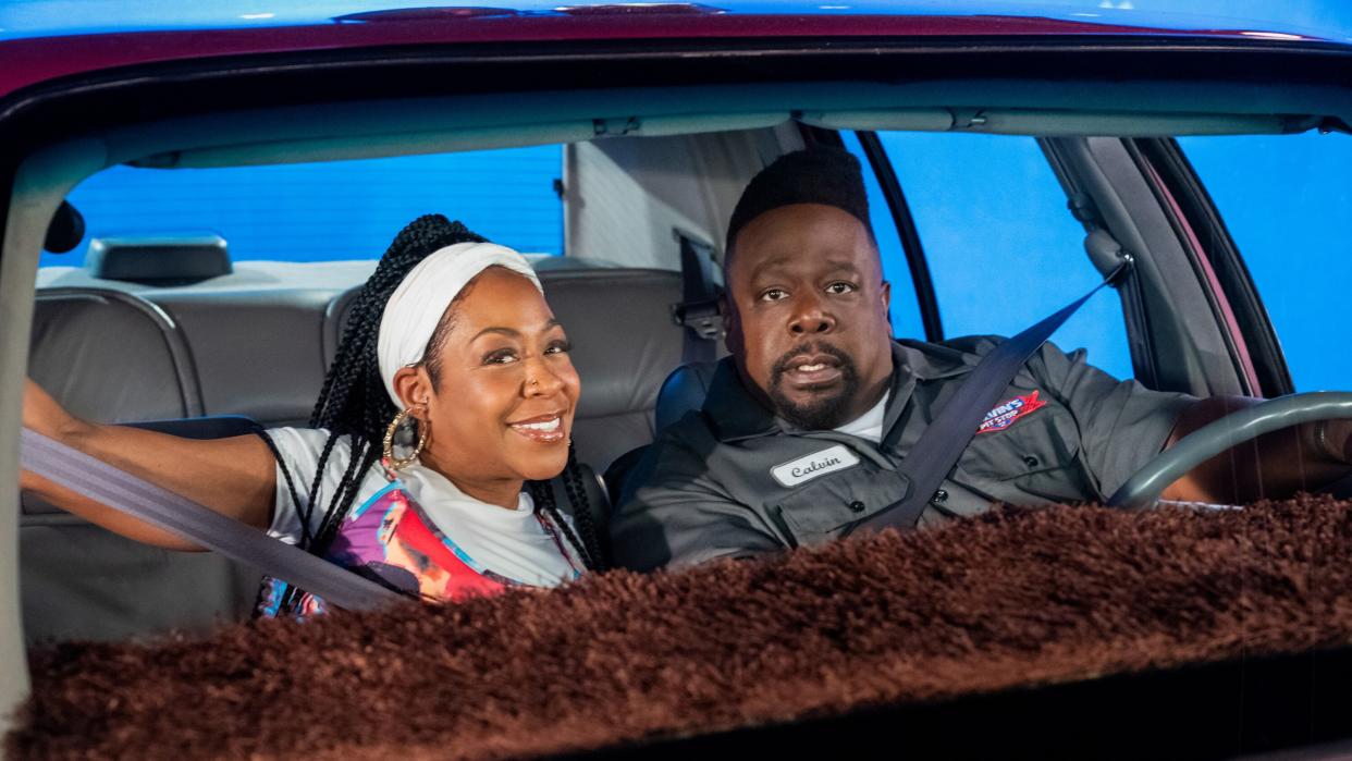  Tichina Arnold as Tina and Cedric the Entertainer as Calvin riding in a car in The Neighborhood season 6 finale. 