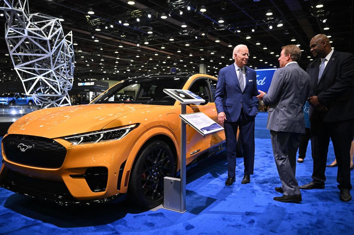 President Joe Biden speaks with Ford Motor Co. Executive Chairman William Clay Ford Jr. beside an electric Mustang. <a href="https://www.gettyimages.com/detail/news-photo/president-joe-biden-speaks-with-ford-motor-company-news-photo/1243225721" rel="nofollow noopener" target="_blank" data-ylk="slk:Mandel Ngan/AFP via Getty Images;elm:context_link;itc:0;sec:content-canvas" class="link ">Mandel Ngan/AFP via Getty Images</a>