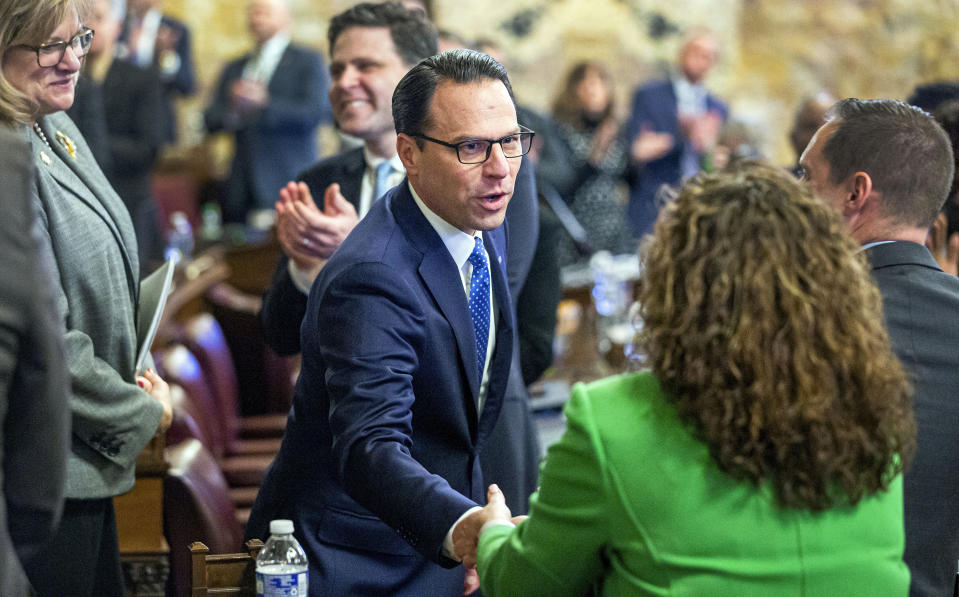 Pennsylvania Gov. Josh Shapiro shakes hands as he works his way through the House floor before his first budget address to a joint session of the state legislature, Tuesday, at the state Capitol in Harrisburg, Pa. (Dan Gleiter/The Patriot-News via AP)