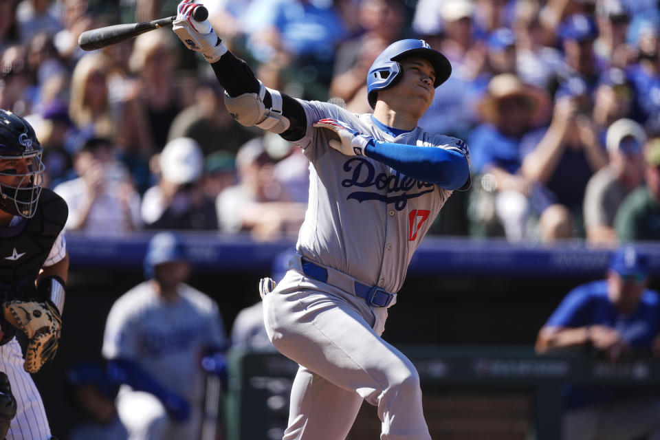 Los Angeles Dodgers' Shohei Ohtani grounds out against Colorado Rockies starting pitcher Ryan Feltner in the first inning of a baseball game Sunday, Sept. 29, 2024, in Denver. (AP Photo/David Zalubowski)