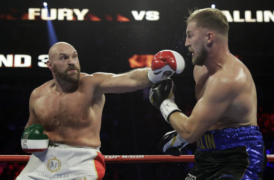 Tyson Fury, of England, punches Otto Wallin, of Sweden, during their heavyweight boxing match Saturday, Sept. 14, 2019, in Las Vegas. (AP Photo/Isaac Brekken)