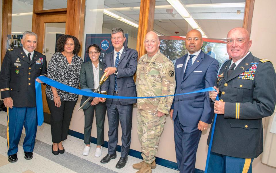 Cutting the ribbon at the Sept. 7 opening of URI’s Center for Military and Veteran Education.
From left: Col. John Petrella Jr. '68, USA, retired; Michelle Fontes '96, interim assistant VP, URI Office of Community, Equity and Diversity; Sgt. Tracy Santos '24, USMC; Marc Parlange, president, University of Rhode Island; Maj. Gen. Christopher P. Callahan, Rhode Island Adjutant General; Sean Edmund Rogers, VP, URI Office of Community, Equity and Diversity; Col. William P. Babcock '68, USA, retired.