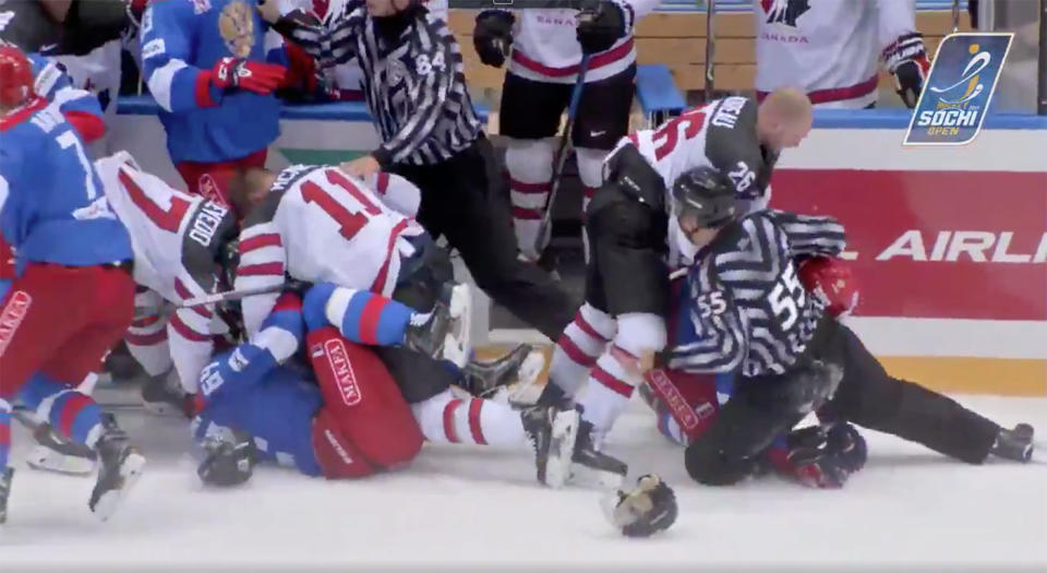 Players from Canada and Russia throw down at the Sochi Hockey Open.