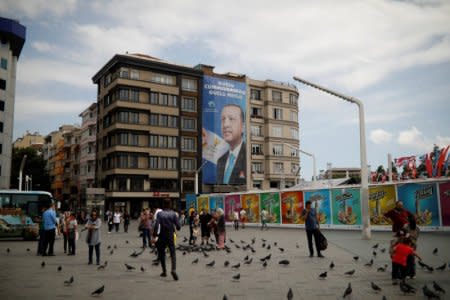 A pre-election poster depicting Turkish President Tayyip Erdogan reads