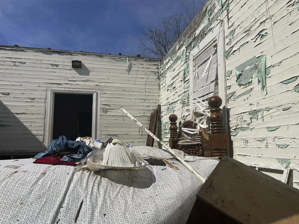 Various items remain in a home destroyed by last month's tornado in Selma, Ala., Tuesday, Feb. 14, 2023. A month after a tornado ravaged historic Selma, a city etched in the history of the civil rights movement, residents and city officials say they are bracing for a long recovery. (AP Photo/Kim Chandler)