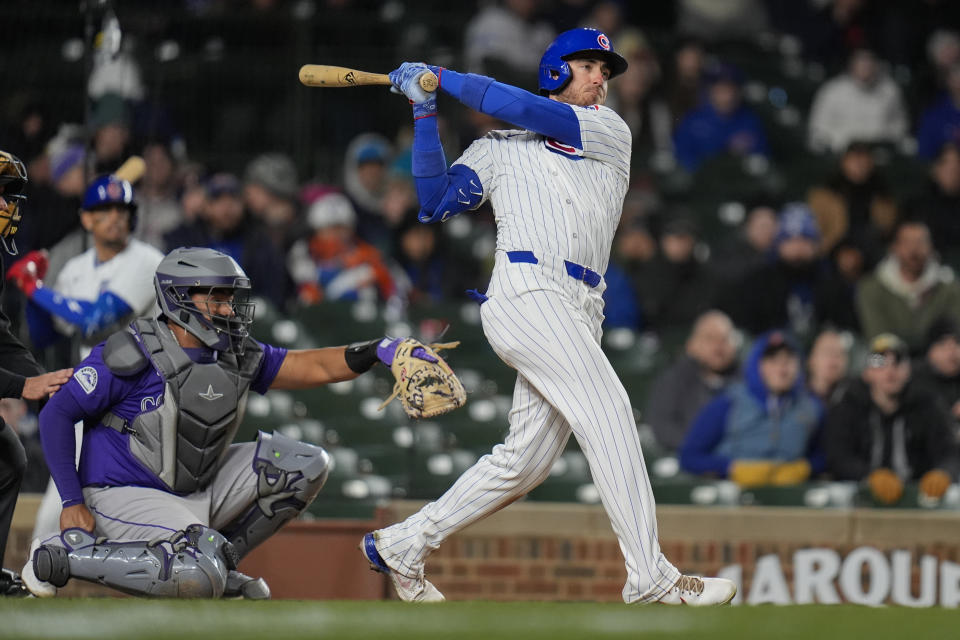 Chicago Cubs' Cody Bellinger hits a two-run home run during the seventh inning of a baseball game against the Colorado Rockies, Tuesday, April 2, 2024, in Chicago. (AP Photo/Erin Hooley)