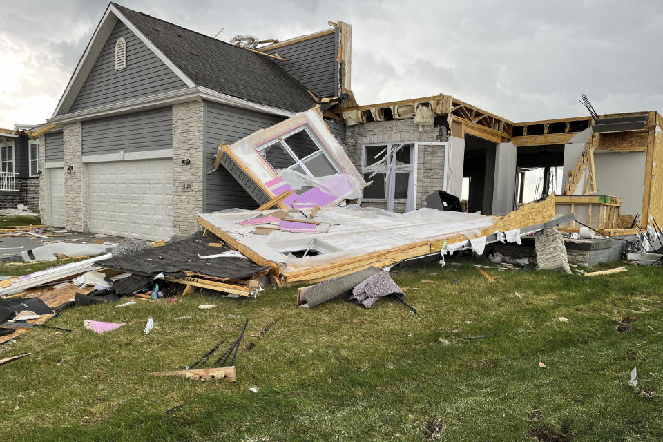 A destroyed home is seen northwest of Omaha, Neb., after a storm tore through the area on Friday, April 26, 2024. (AP Photo/Margery A. Beck)