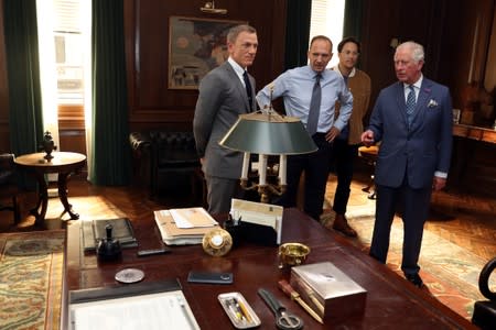 Britain's Prince Charles visits the set of James Bond at Pinewood Studios