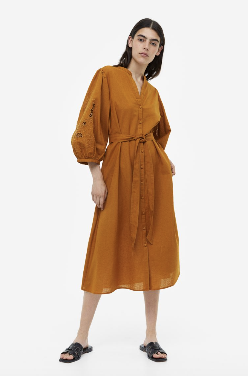 model wearing brown copper long sleeve midi dress, Eyelet Embroidery Dress (Photo via H&M)