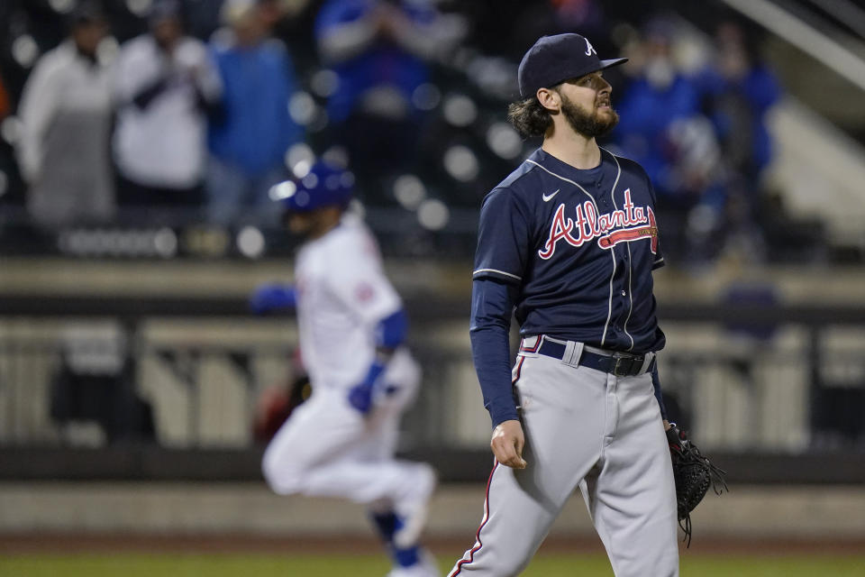 Atlanta Braves' Ian Anderson reacts as New York Mets' Jonathan Villar runs the bases on a home run during the fifth inning of a baseball game Saturday, May 29, 2021, in New York. (AP Photo/Frank Franklin II)