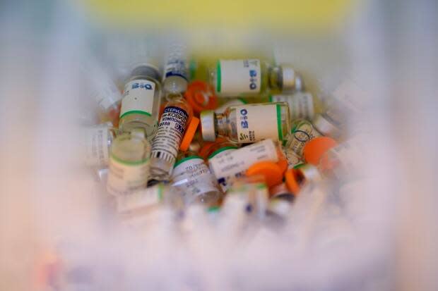 Empty vials of the Sputnik V and Sinopharm vaccines fill a container at Tecnopolis Park in Buenos Aires, Argentina, in April.