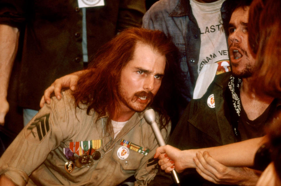 Tom Cruise gives a speech while in a wheelchair and veterans uniform