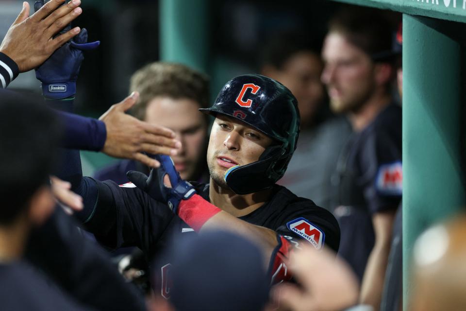 Guardians center fielder Tyler Freeman high fives teammates after hitting a home run during the fifth inning against the Red Sox at Fenway Park, April 16, 2024, in Boston.