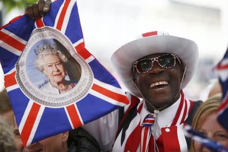 A supporter waits for the arrival of members of Britain's royal family to a service of thanksgiving for Queen Elizabeth's 90th birthday at St Paul's cathedral in London, Britain, June 10, 2016. REUTERS/Peter Nicholls