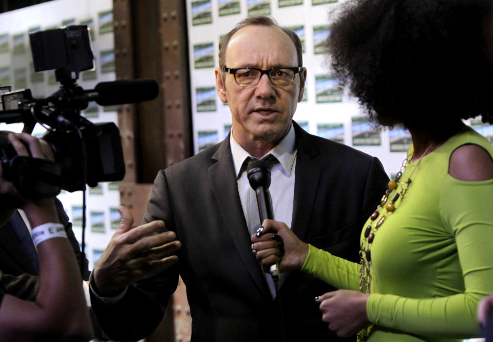 American actor Kevin Spacey speaks to the press as he arrives for the premiere of "Spirit Of A Denture" in Johannesburg, South Africa, Saturday, May 12, 2012. Spacey spoke about his international outlook during a brief visit to Johannesburg for the premiere of the South African short film he helped produce and in which he stars. (AP Photo/Denis Farrell)