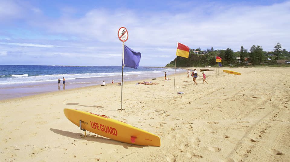 A surfer has been slammed for breaking the 'sacred' rule of moving into the flagged area. Source: Getty