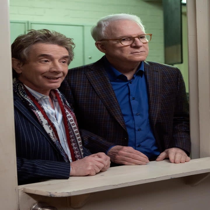 Martin Short and Steve Martin look in a window