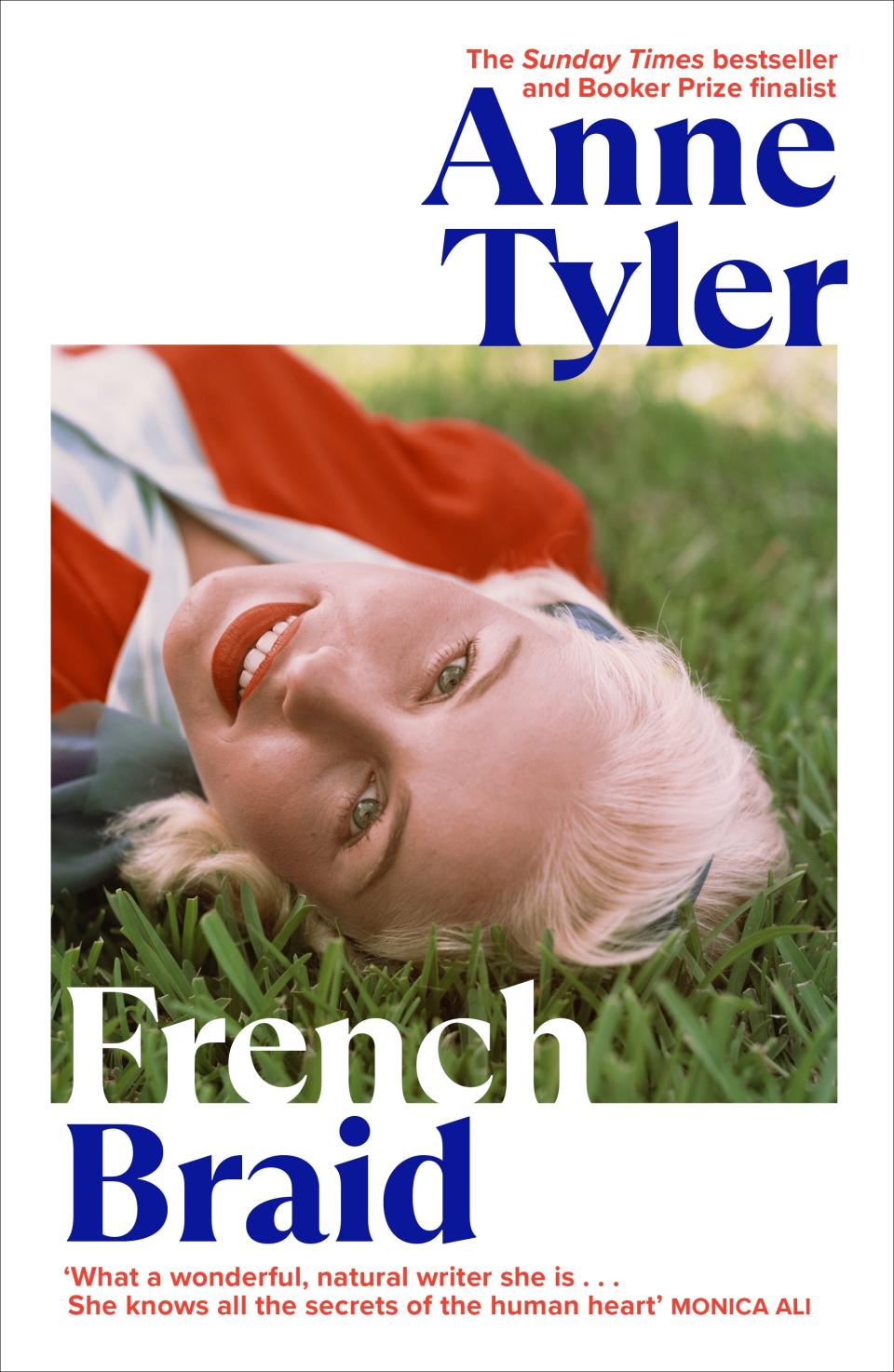 The cover of French Braid by Anne Tyler, $22.50 showing a woman lying on the grass looking at the camera.