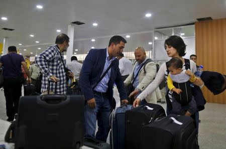 Foreigners wait for their flights as they prepare to leave Yemen via Sanaa Airport March 28, 2015. REUTERS/Khaled Abdullah