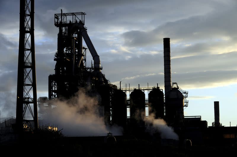 Blast furnaces of the Tata Steel plant seen at sunset in Port Talbot