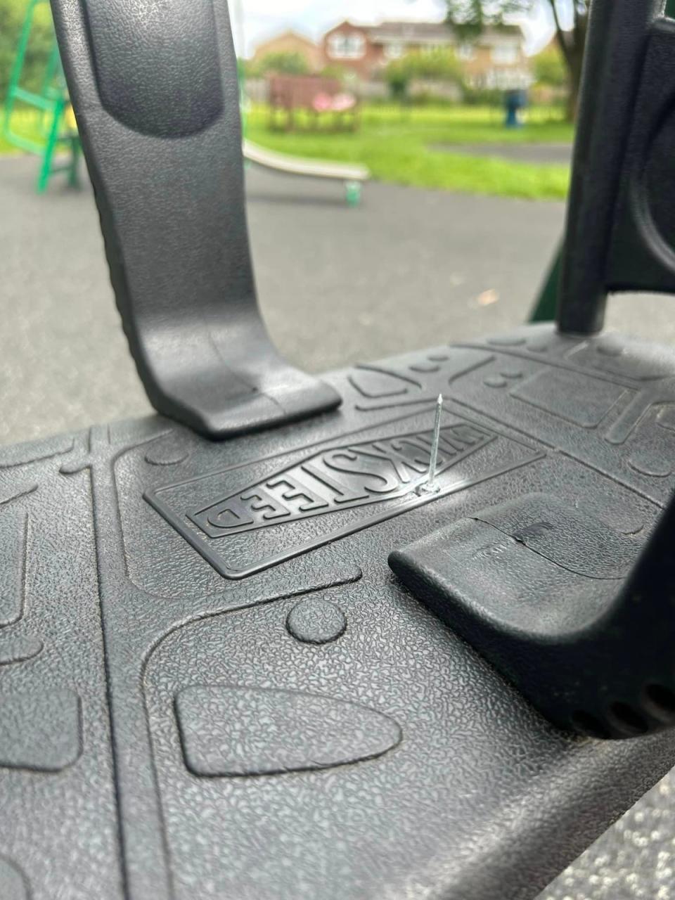 A nail was glued to the swing of the playground (Supplied)