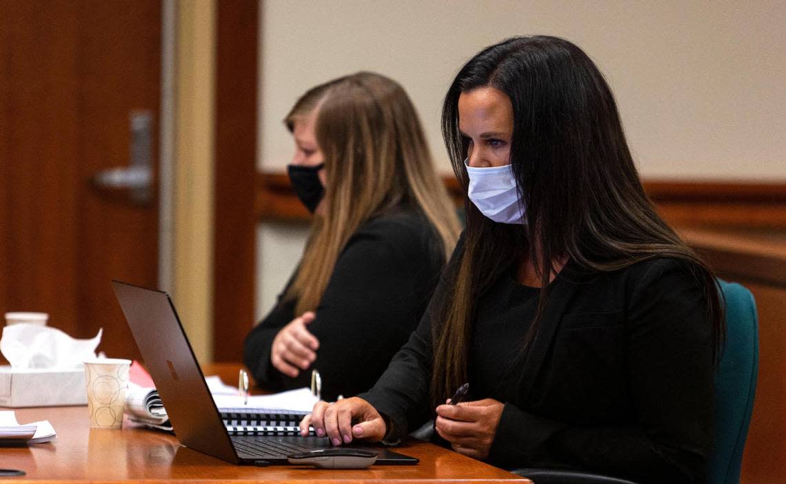 Attorney Edwina Elcox, who is representing Danielle Radue, reads through a document during her client’s sentencing on Friday.