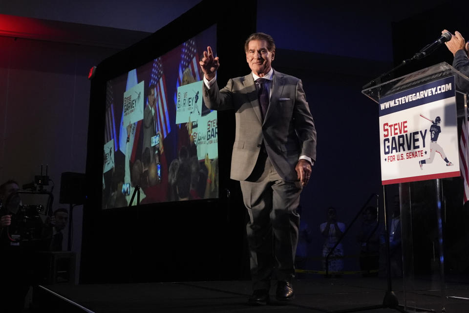 Republican U.S. Senate candidate Steve Garvey waves to supporters as he walks on the stage during his election night party, Tuesday, March 5, 2024, in Palm Desert, Calif. (AP Photo/Gregory Bull)