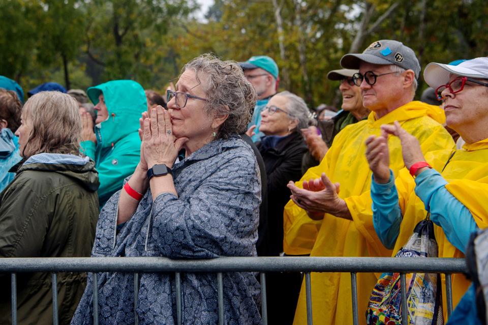 People listen to Minnesota Governor and Democratic vice presidential candidate Tim Walz at Salvage Station in Asheville, September 17, 2024.