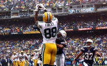 SAN DIEGO, CA - NOVEMBER 6: Tight end Jermichael Finley #88 of the Green Bay Packers catches the ball for a touchdown as Steve Gregory #28 and Eric Weddle #32 of the San Diego Chargers look on, on November 6, 2011 at Qualcomm Stadium in San Diego, California. (Photo by Donald Miralle/Getty Images)