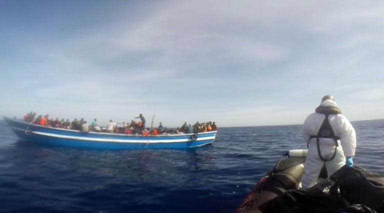 Italian Coast Guard take part in a rescue operation of a boat carrying 397 migrants, on May 2, 2015, in the Mediterranean Sea, as seen in this image grab from a video