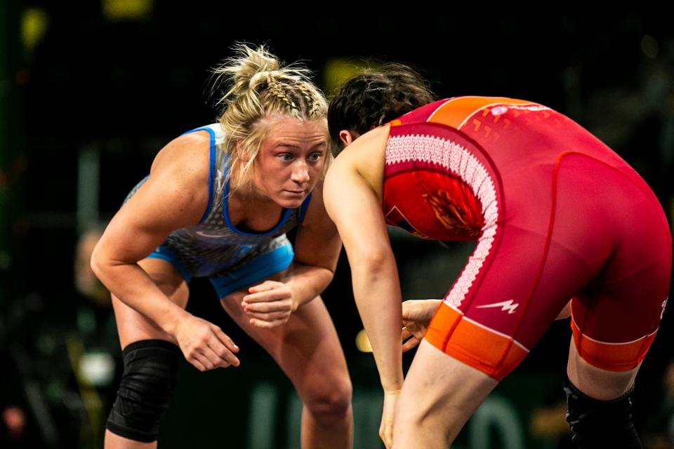 Felicity Taylor of the United States, left, wrestles Otgonjargal Ganbaatar of Mongolia at 53 kg during the United World Wrestling women's freestyle World Cup Dec. 11 at Xtream Arena in Coralville.