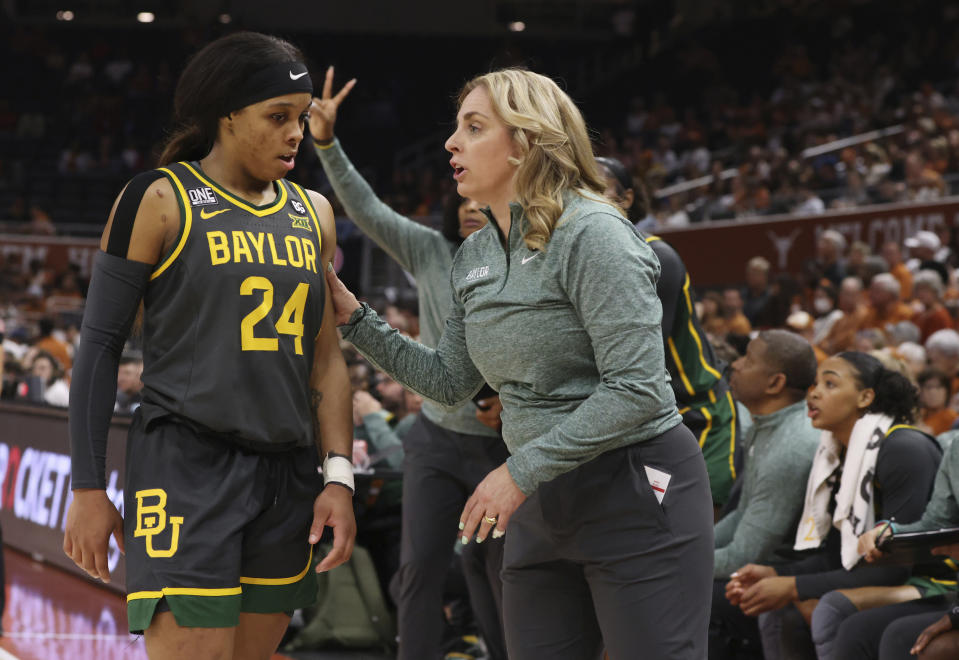 Baylor head coach Nicki Collen, front right, talks with guard Sarah Andrews (24) during a stop in the action against Texas in the second half of an NCAA college basketball game, Monday, Feb. 27, 2023, in Austin, Texas. (Rod Aydelotte/Waco Tribune-Herald via AP)