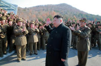 <p>This undated picture released by North Korea’s Korean Central News Agency on March 7, 2017, shows North Korean leader Kim Jong Un waving to North Korean officers during the launch of four ballistic missiles by Korean People’s Army (KPA) during a military drill at an undisclosed location in North Korea. Nuclear-armed North Korea launched four ballistic missiles on March 6 in another challenge to President Donald Trump, with three landing provocatively close to America’s ally Japan. (AFP photo/KCNA via KNS/Getty Images) </p>