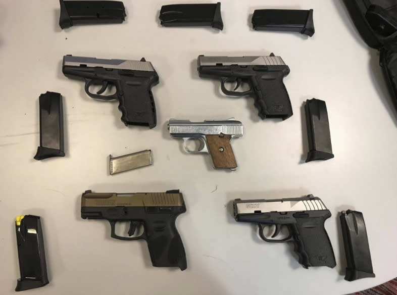 This image provided by U.S. Attorney's Office for the Eastern District of New York, shows semi-automatic handguns seized in undercover transactions in the Canarsie neighborhood of the Brooklyn borough of New York. Four men charged Wednesday, Jan 11, 2023, under a new federal gun trafficking law are accused of selling more than 50 guns to an undercover officer, along with fentanyl and crack cocaine. (U.S. Attorney's Office for the Eastern District of New York via AP)