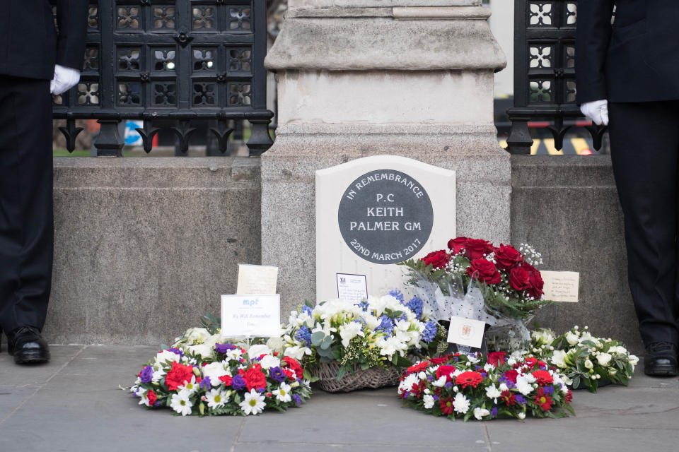 Floral tributes at the unveiling of a national memorial outside the Carriage Gates, at the Palace of Westminster, in memory of Pc Keith Palmer, who was killed during a terrorist incident in Westminster in 2017.