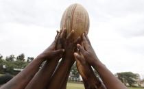 Members of the Kenya Women's Rugby team hold the ball as a team after a light training session at the RFUEA grounds in the capital Nairobi, April 4, 2016. REUTERS/Thomas Mukoya
