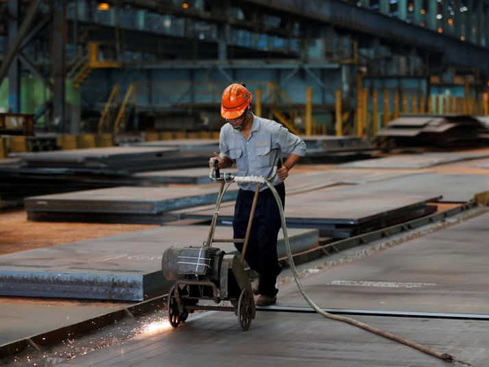 A worker cuts steel plates inside the China Steel Corporation factory, in Kaohsiung, southern Taiwan August 26, 2016. REUTERS/Tyrone Siu/File Photo                 