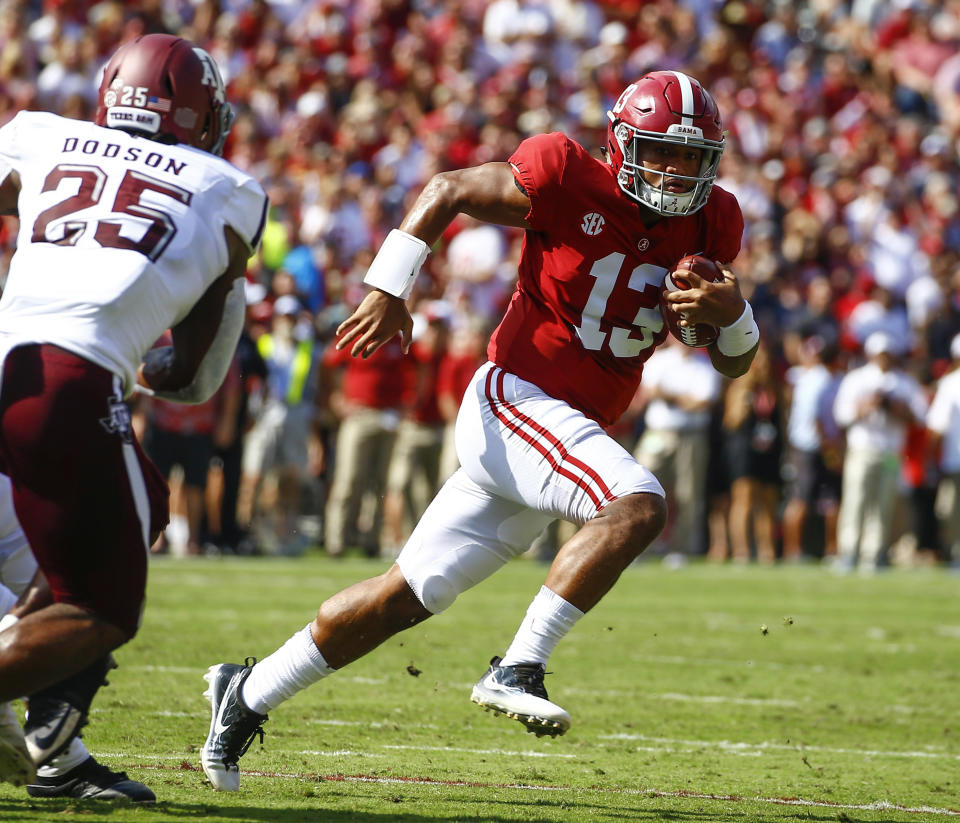 Alabama quarterback Tua Tagovailoa (13) earned a place as a Heisman finalist in his first season as Alabama’s starting quarterback. (AP Photo/Butch Dill)